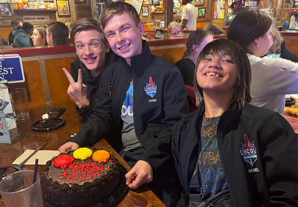 student travel group having a birthday party celebration